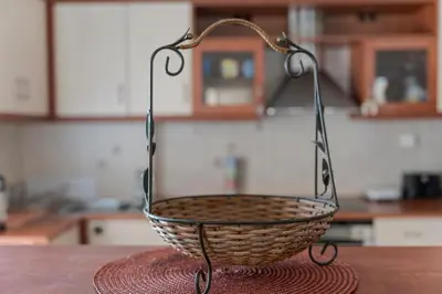 a basket sitting on top of a table in a kitchen at Comfortable Family Apartment,3 stops to Acropolis in Athens
