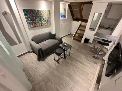 a living room with a couch and a table at Ground floor next to Errikos Ntinan and Erithros in Athens