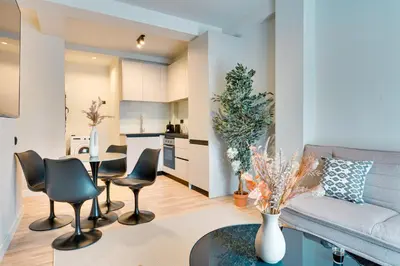 a living room with a couch and chairs and a table at Skyline Spa Athens 110 in Athens