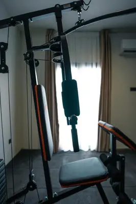 a room with a gym equipment with a chair at Skyline Spa Athens 210 in Athens