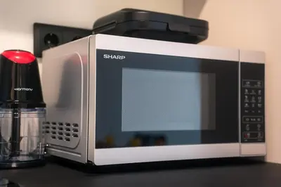 a microwave sitting on a counter next to a blender at Skyline Spa Athens 210 in Athens