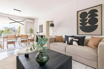 a living room with a couch and a table at Family Escape in Chalandri by UPSTREET in Athens