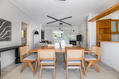 a dining room with a wooden table and chairs at Family Escape in Chalandri by UPSTREET in Athens