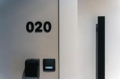 a white door with the number zero on it at Skyline Spa Athens 020 in Athens