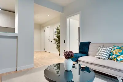 a living room with a couch and a table at Skyline Spa Athens 020 in Athens