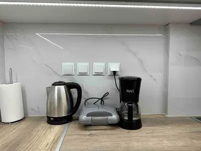 a coffee maker and a blender on a counter at Downtown modern apartment in Athens