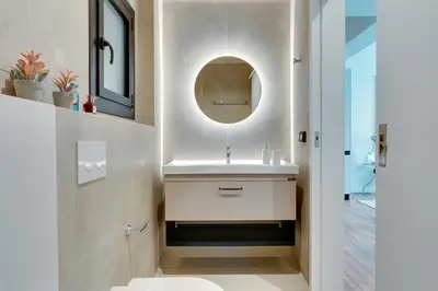 a bathroom with a sink and a mirror at Skyline Spa Athens 310 in Athens