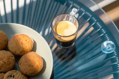 a plate of muffins and a glass of drink at Skyline Spa Athens 310 in Athens
