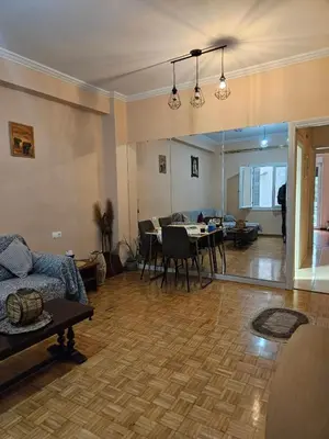 a living room with a table and a dining room at Apartment in Athens in Athens