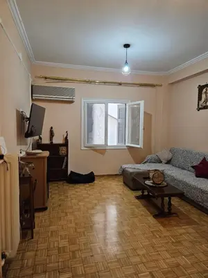 a living room with a couch and a table at Apartment in Athens in Athens
