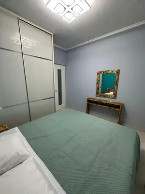 a bedroom with a large bed and a mirror at Lilia Apartments in Athens
