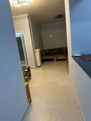 a living room with a couch in a room at Lilia Apartments in Athens