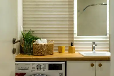 a kitchen counter with a sink and a basket on it at Sunny and friendly apartment in Piraeus