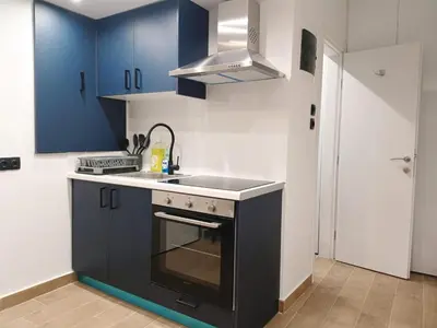 a kitchen with a sink and a stove top oven at Blue Beach Apartment in Athens Alimos Kalamaki in Athens
