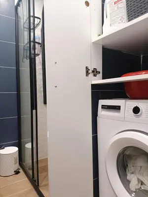 a bathroom with a washing machine and a shower at Blue Beach Apartment in Athens Alimos Kalamaki in Athens