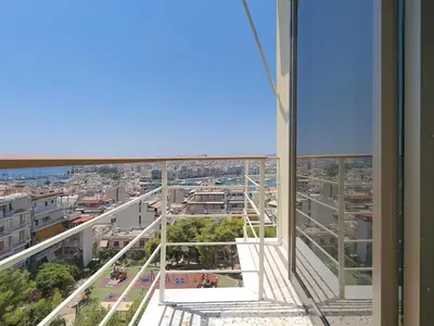 a view of a city from a building at Top-Floor Modern Penthouse with Stunning Sea Views in Piraeus