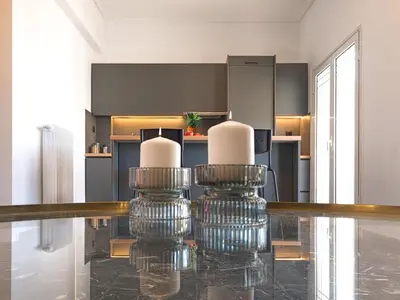a dining room with a glass table with two chairs at Top-Floor Modern Penthouse with Stunning Sea Views in Piraeus