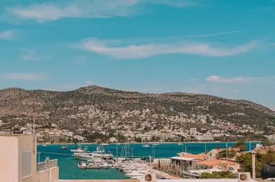 a view of a harbor with boats in the water at Royal Fig Apartment Porto Rafti in Porto Rafti