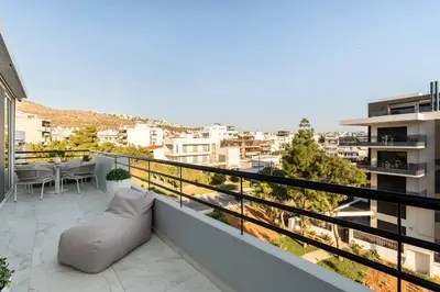 a balcony with a view of a city at Luxury Modern Apartment with Stunning Glyfada View in Athens