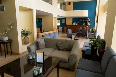 a living room with a couch and a table at Four Seasons Hotel in Athens