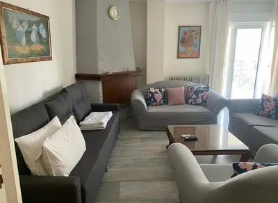 a living room with couches and a coffee table at Chalandri Bloom Residence 2BR Sleeps 6 in Athens