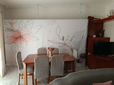 a dining room with a table and a wall with flowers at Chalandri Bloom Residence 2BR Sleeps 6 in Athens