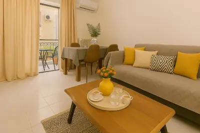 a living room with a couch and a table at Central, Quiet & Comfortable Apartment in Athens