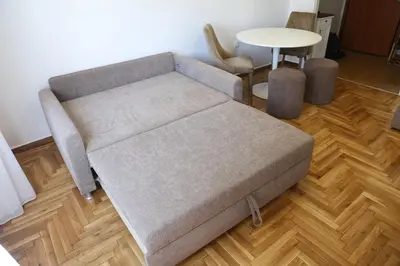 a couch in a living room with a table at Serene & Stylish apt by GHH in Athens