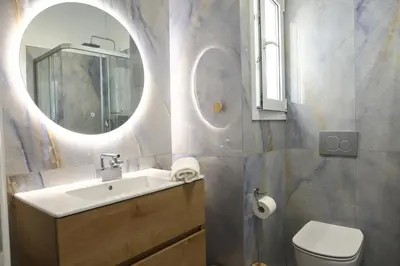 a bathroom with a sink and a mirror at Serene & Stylish apt by GHH in Athens
