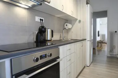 a kitchen with a sink and a stove top oven at Serene & Stylish apt by GHH in Athens