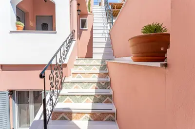 a set of stairs in a house with a potted plant at B2 Porto Living in Piraeus
