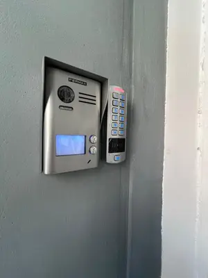 a cell phone is hanging on a wall at Μοντέρνο διαμέρισμα στη Δάφνη in Athens