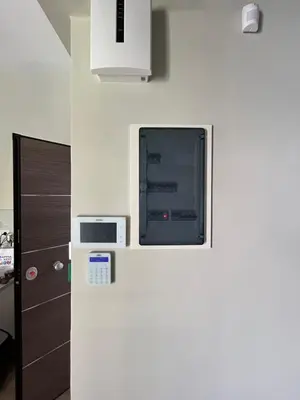 a refrigerator with a microwave on top of it at Μοντέρνο διαμέρισμα στη Δάφνη in Athens