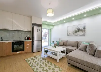 a living room with a couch and a table at Penthouse 4BD apt near Acropolis and metro in Athens
