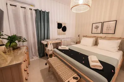 a bedroom with a large bed in a room at Theonisxenia Luxury Apt at Metro M3 in Athens