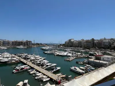a group of boats docked in a harbor at Piraeus Pearl - Seaview Elegance in Piraeus