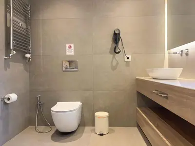 a bathroom with a toilet and a sink at Luxurious & Spacious Flat in Glyfada Center in Athens