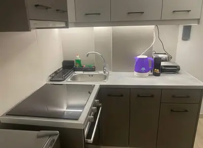 a kitchen with a sink and a stove and a sink at Cozy City Hideaway in Zografou in Athens