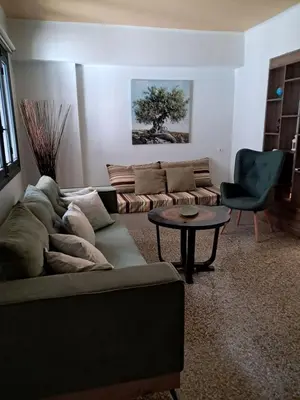 a living room with a couch and a table at Athenian Stay 301 By VPN in Athens