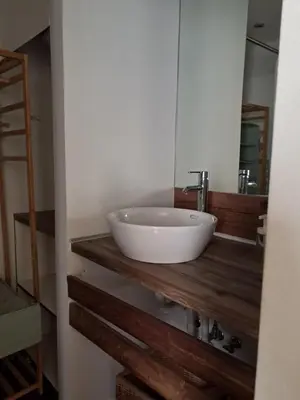 a bathroom with a white sink and a mirror at Athenian Stay 301 By VPN in Athens