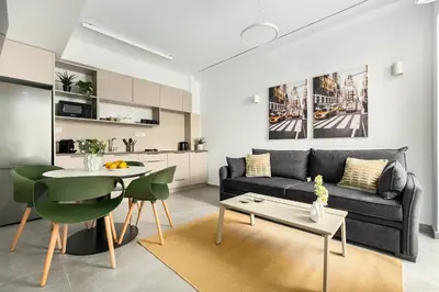 a living room with a couch and a table at The Magnificent Exarchia Loft Apartments in Athens