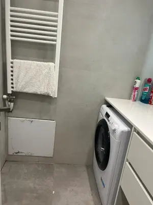 a laundry room with a washing machine in it at New apartment in Athens