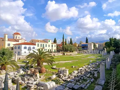 a cemetery in a city with buildings and palm trees at Kalliopi Studio in Athens