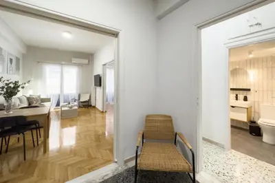 a kitchen and dining room with a table and chairs at Casa Bianca in Pagrati in Athens