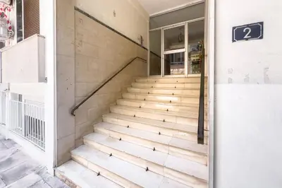 a set of stairs outside of a building at Casa Bianca in Pagrati in Athens