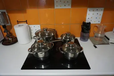 a group of pots and pans on top of a stove at Sharing can change the world! in Athens