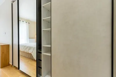 a large mirror in a room with a bedroom at The Sea Breeze, Glyfada in Athens