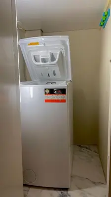 a white refrigerator with its door open in a room at LuxBlue Apartment Kypseli in Athens