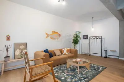 a living room with a couch and a table at 1BR Designer Apt Next To Metro & 15 minutes to Acropolis in Athens