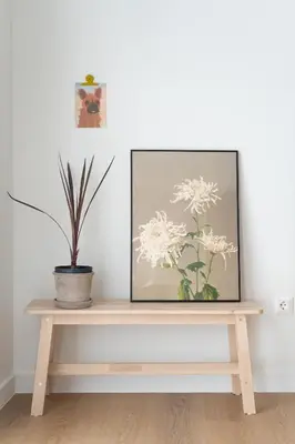 a picture on a wooden table with a plant on it at 1BR Designer Apt Next To Metro & 15 minutes to Acropolis in Athens